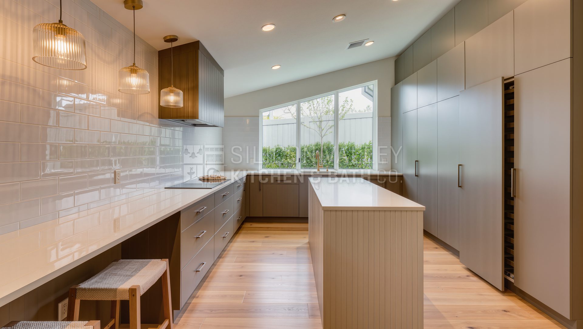 Greige slab + fluted island with hidden pantry (Cupertino) kitchen — Silicon Valley Kitchen & Bath Co.